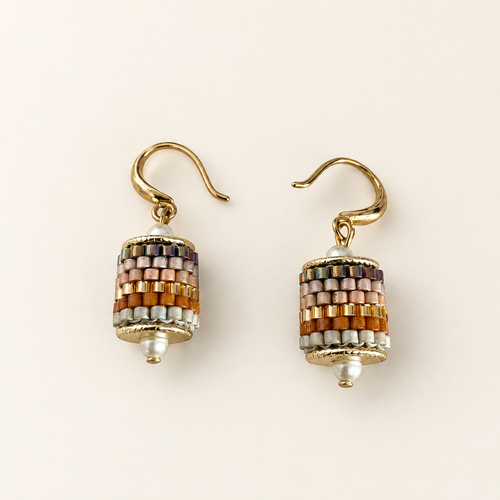 Pair of gold-toned beaded drop earrings in blush, amber, pale grey and iridescent tones on ivory