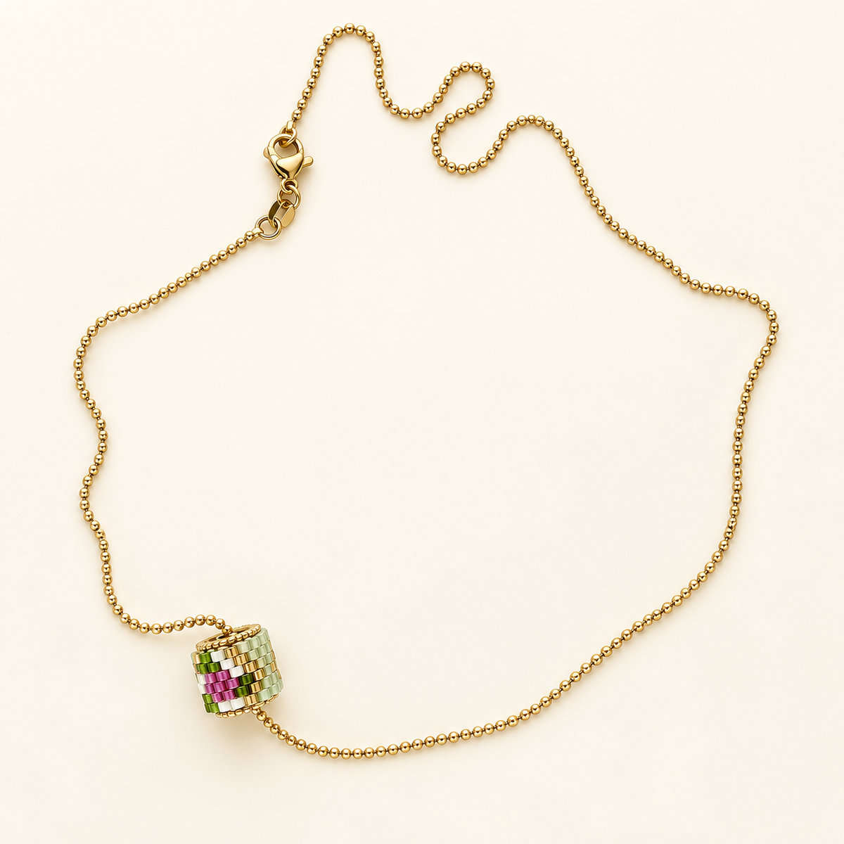 Gold-toned chain necklace with mint green, white and pink cylindrical beadwork