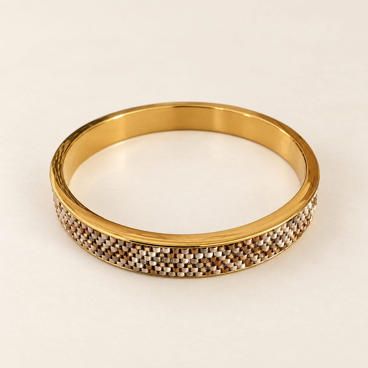 Gold-toned bangle with intricate white, champagne and warm metallic beadwork